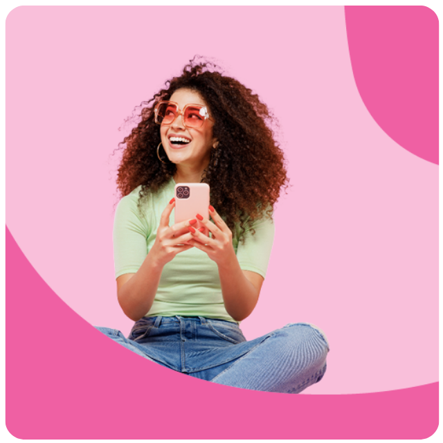 Smiling woman with glasses holding a phone